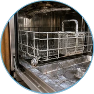 Scale and mineral damage inside a dishwasher
